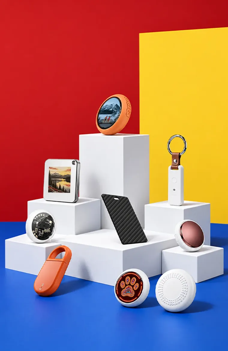 Ready-stock tracker formats — cards, tags, keys and finders — staged on studio plinths